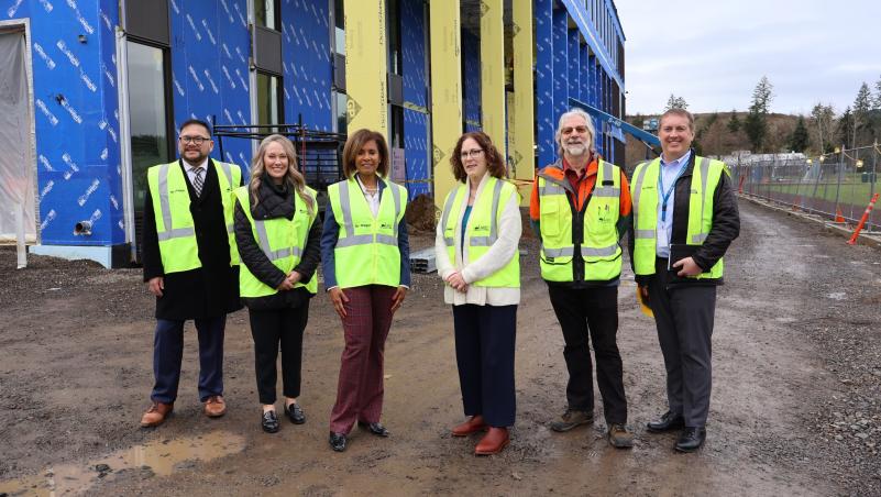 Congresswoman Hoyle, LCC President Stephanie Bulger and college staff in front of the future Health Professions Building