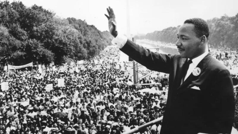 Dr. Martin Luther King, Jr. waves to supporters at a rally in Washington, DC