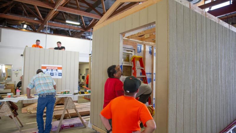 Instructors demonstrate how to build a tiny home at a Team Oregon Build event, hosted by Lane Community College.