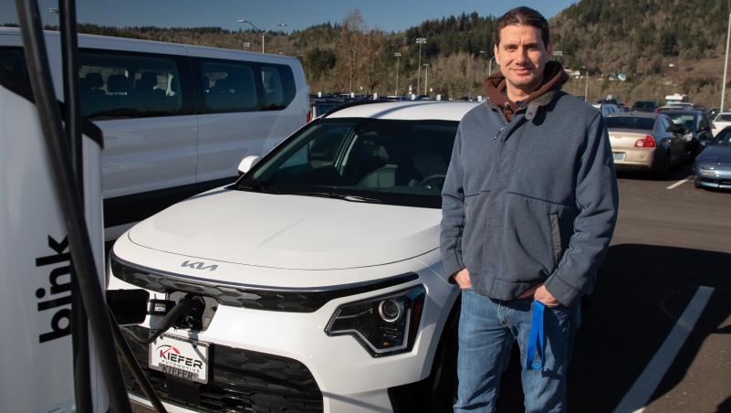 Luis Maggiore charges the newest addition to the LCC motorpool - an electric car funded by a grant through EWEB.