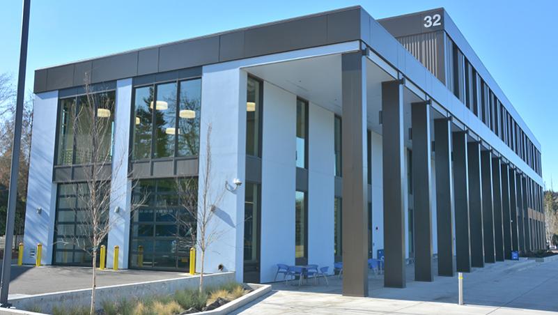 the exterior of the Health Professions building on a sunny day showing the ambulance bay