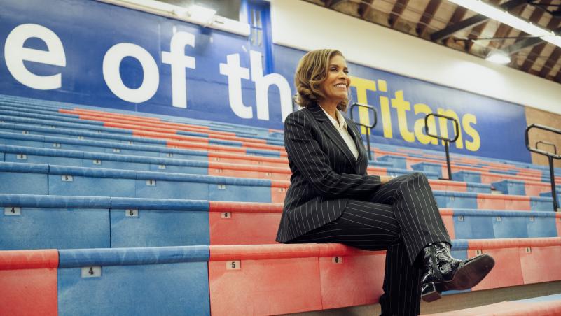 Dr. Stephanie Bulger in bleachers at basketball game