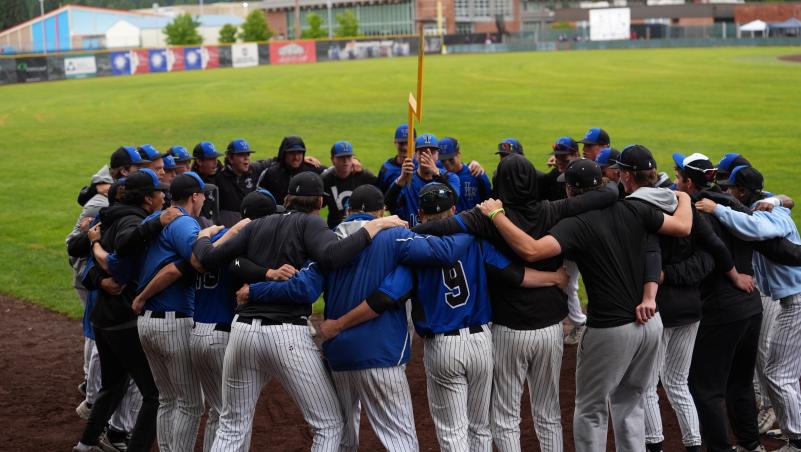 Titans baseball team huddle holding lightning strike symbol