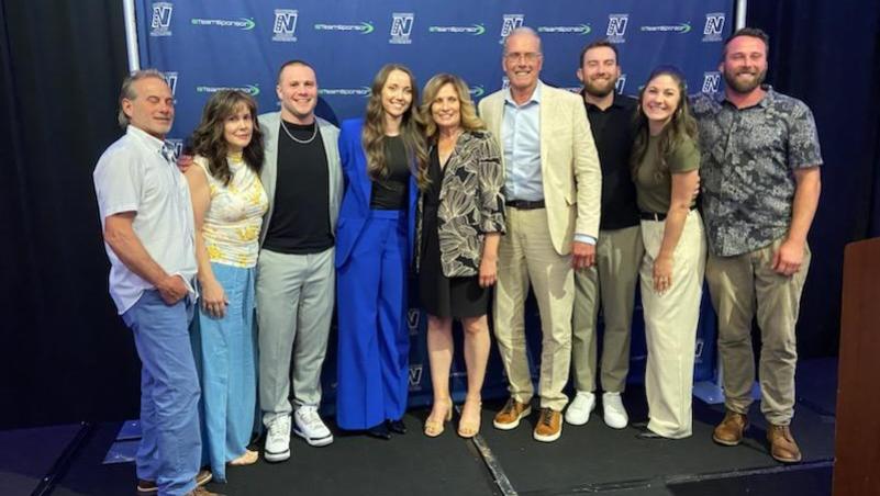 a group of smiling people pose at the NWAC hall of fame awards in Portland