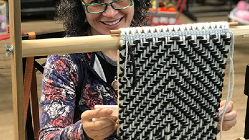 Susan Pavel weaving a wallhanging