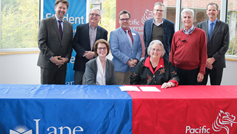 LCC President Margaret Hamilton (L), Pacific University President Lesley Hallick and members of the partnership team.