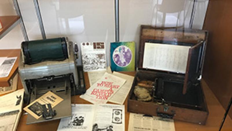 image of display with copier, typewriter and printed materials