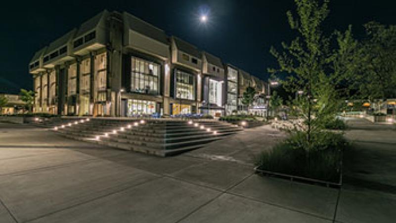 LCC Center Bldg. at night. Photo by Derek Vincent image of center building, under full moon