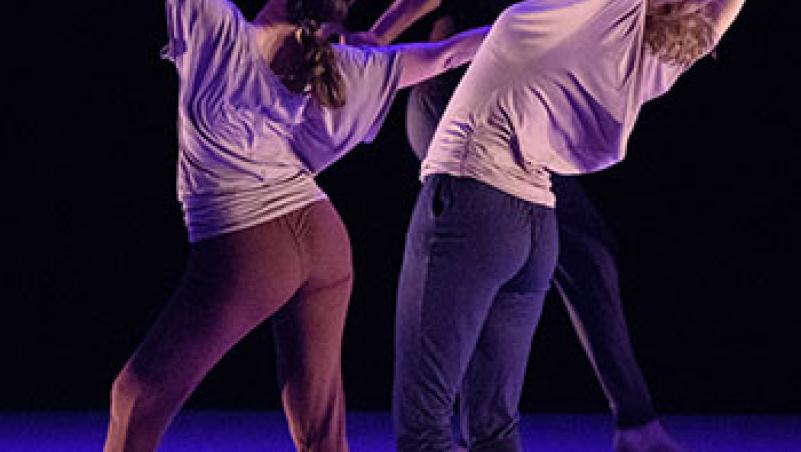 Lane dancers practice for “Collaborations 2018” image of three Lane dancers in movement, on stage
