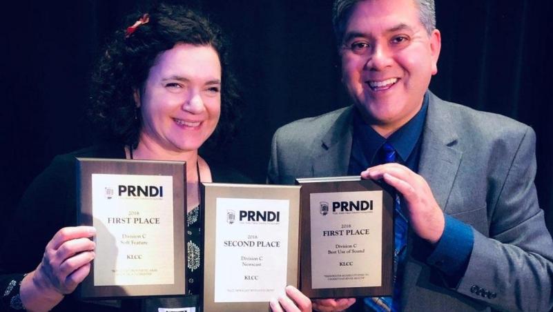two KLCC employees happily accept awards