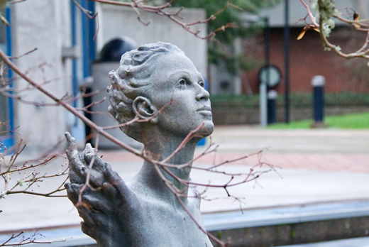 a sculpture of woman's head outside the Ragozzino Theatre