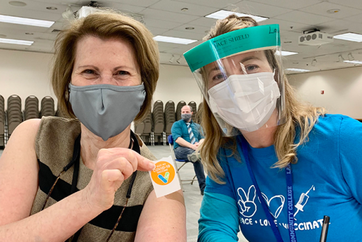 LCC President Margaret Hamilton celebrates her vaccine shot with Health Clinic Director Laura Greene 4-2021