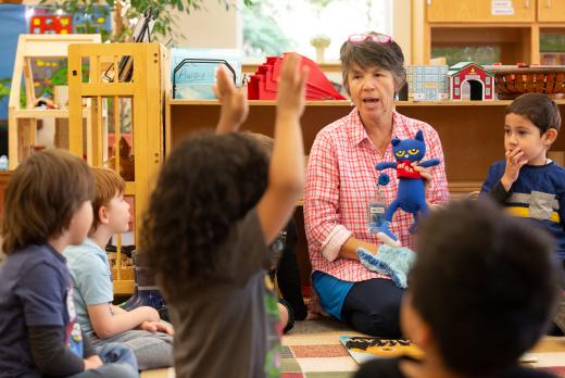 Childcare provider with a stuffed animal