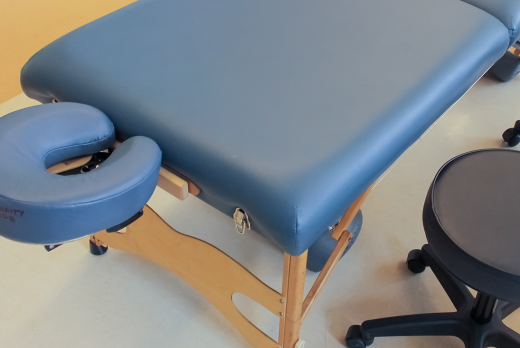 massage table and a stool