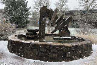 Snow falls on the West Garden fountain, LCC main campus
