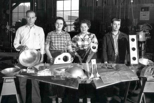 male and female aviation maintenance students in the 1940s