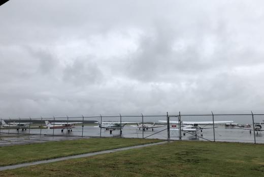 LCC's flight school planes parked on a tarmac on a cloudy day