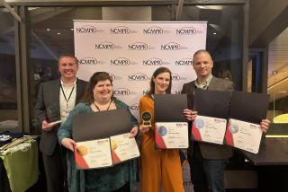 The Lane marketing team holding awards