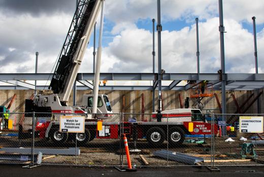 cranes and other construction machines at the ITEC building site