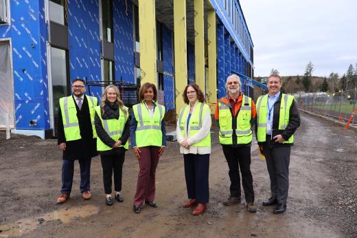 Congresswoman Hoyle, LCC President Stephanie Bulger and college staff in front of the future Health Professions Building