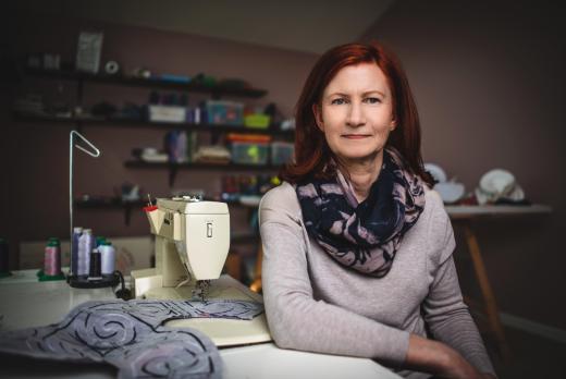 Artist Claire B. Jones sits in her workspace.