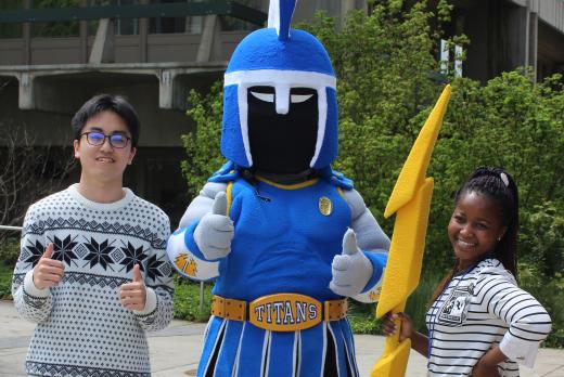 Two students pose with Ty the Titan