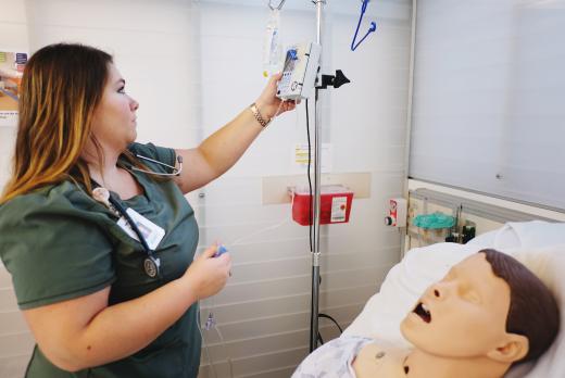 Nursing student with educational mannequin