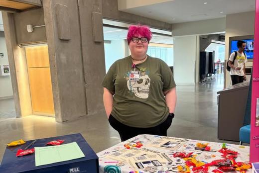 Kat Tabor, the editor of the Torch, recruits students at a club fair