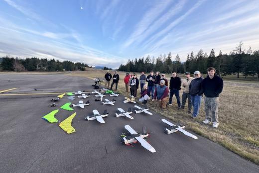 drone students posing with their drones at the rural Oakridge airport