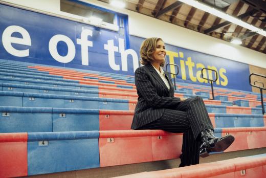 Dr. Stephanie Bulger in bleachers at basketball game