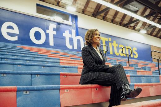 President Stephanie Bulger, in the gym, on bleachers.