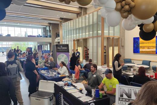 photo of tables and students at job fair