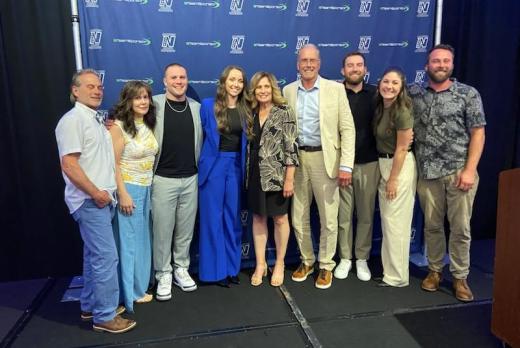 a group of smiling people pose at the NWAC hall of fame awards in Portland