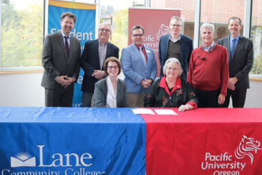 LCC President Margaret Hamilton (L), Pacific University President Lesley Hallick and members of the partnership team.