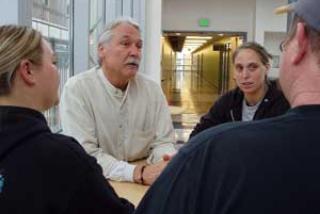 image of Roger Ebbage talking with students