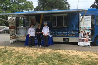 image of LCC Food Truck and three employees