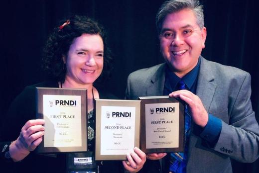 two KLCC employees happily accept awards