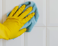 person cleaning with gloves on