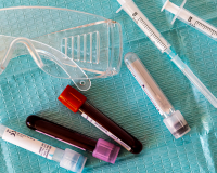 syringes and vials of blood