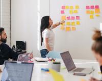 Image of a team working at a whiteboard