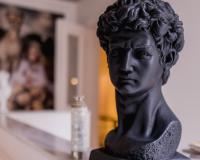 sculpture of a head on a desk
