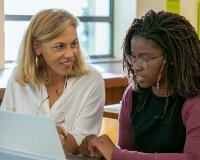 woman smiling at another woman