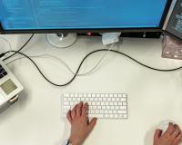 hands at a computer work station