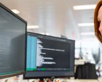 woman looking at a monitor