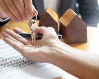 real estate handing house keys to a client