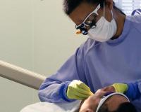 Dental Hygiene student with patient
