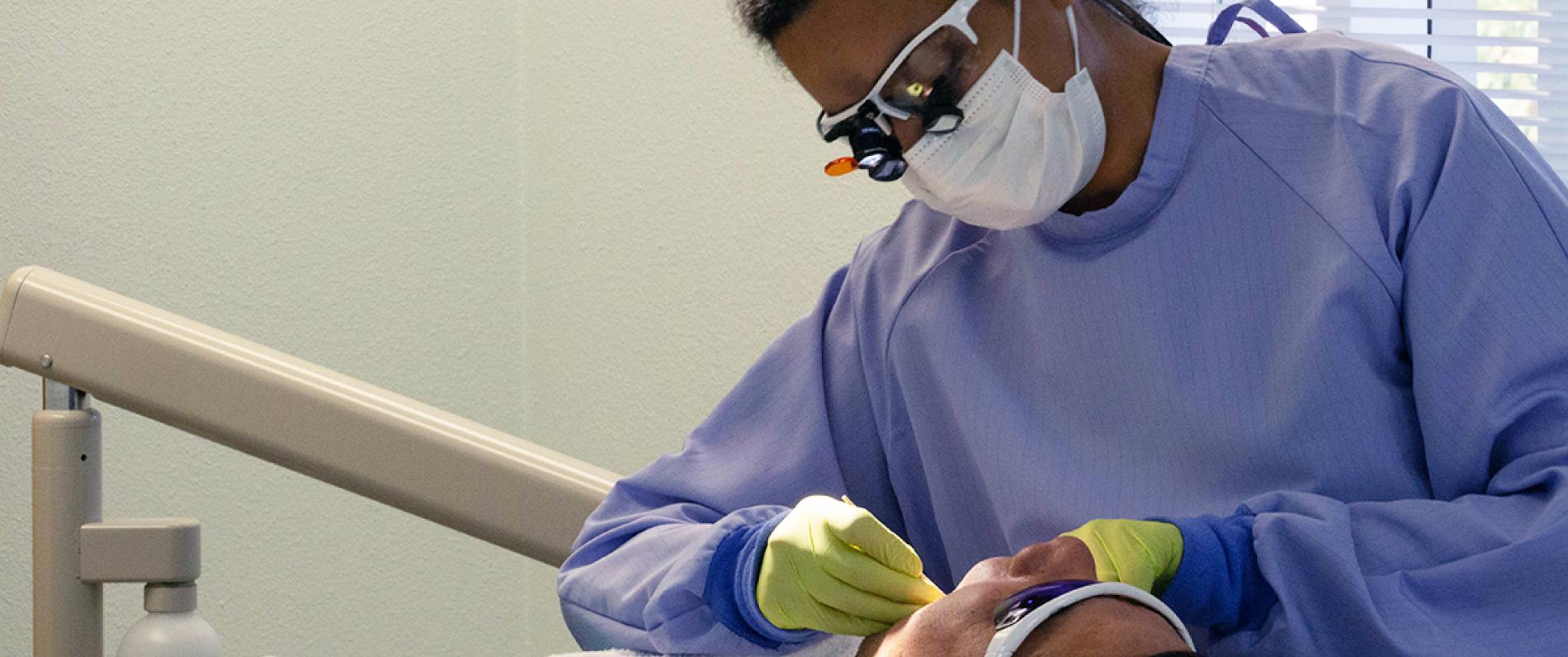 Dental Hygiene student with patient