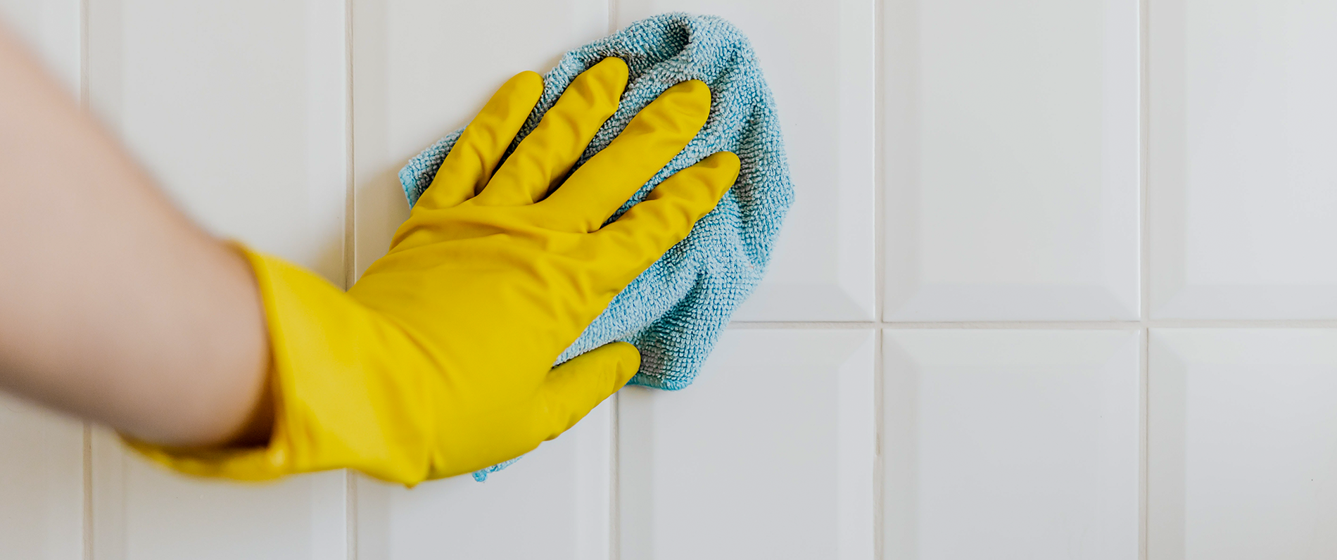 person cleaning with gloves on