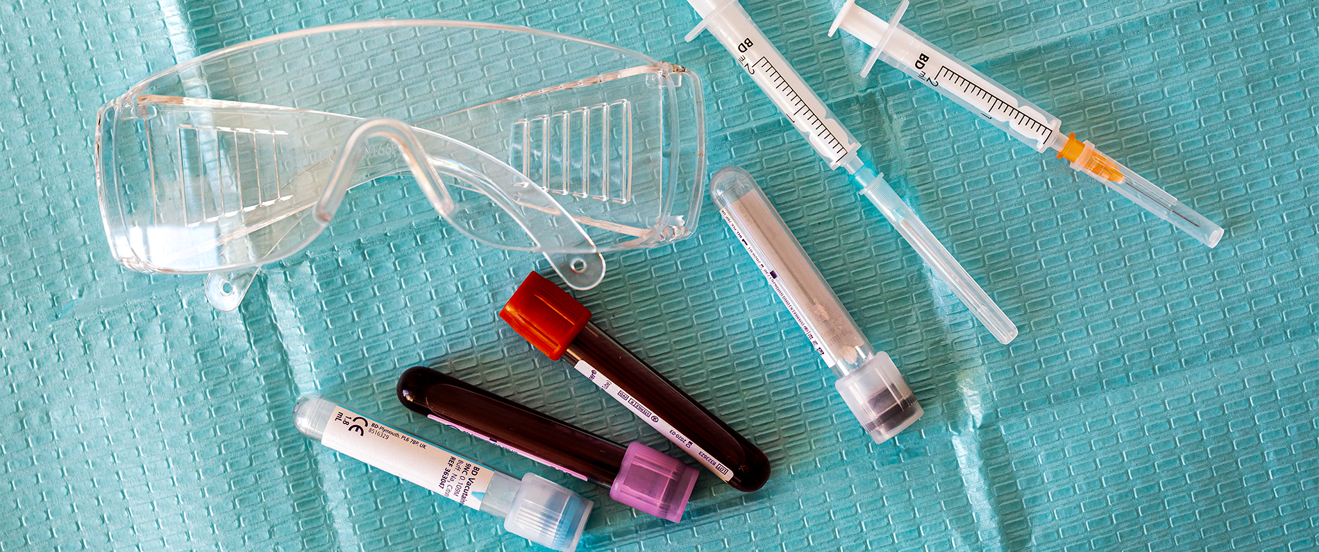 syringes and vials of blood