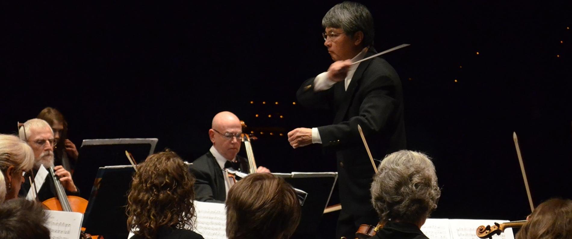man conducting an orchestra
